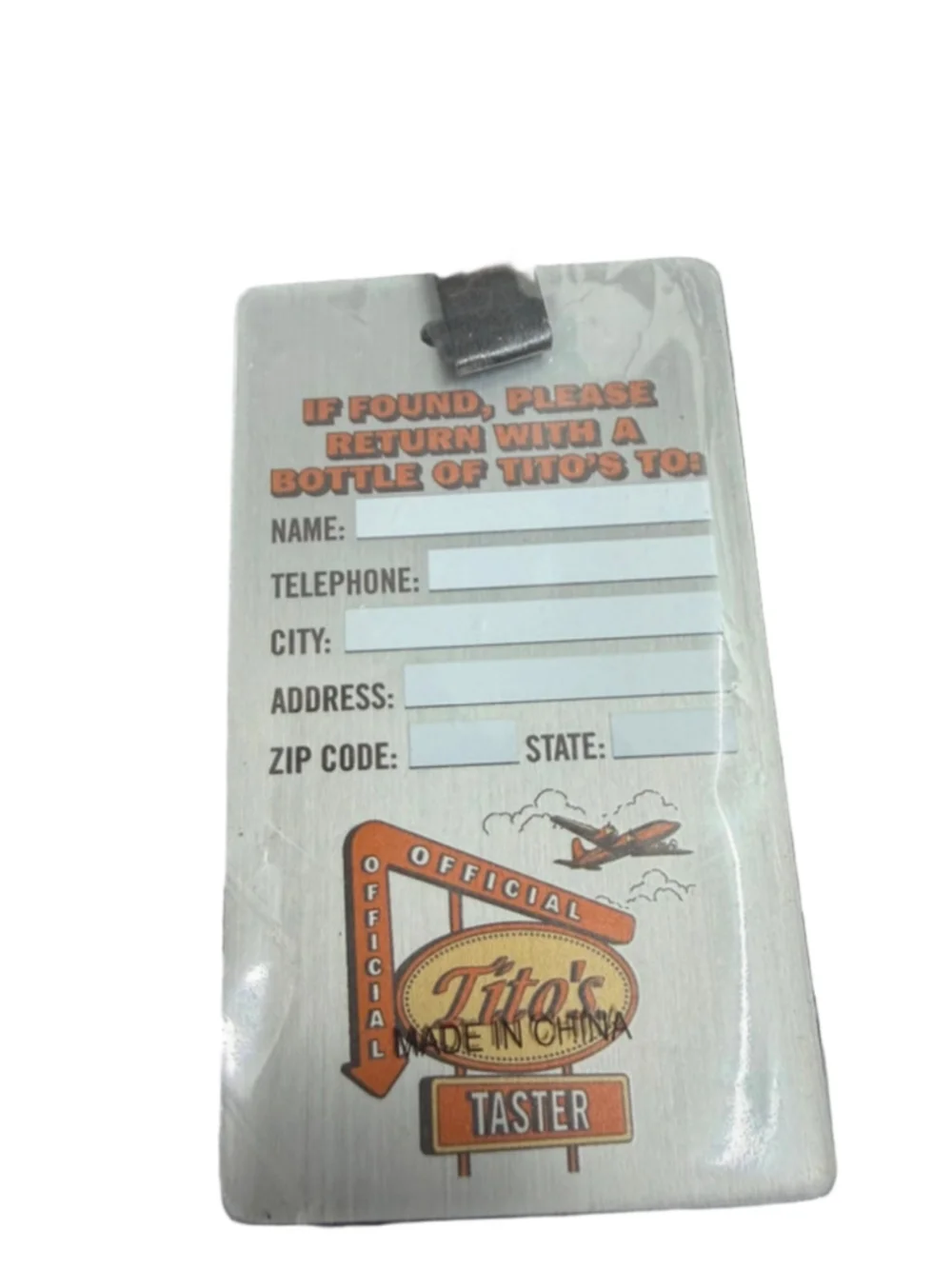 Tito’s Handmade Vodka 25th Anniversary Bottle Stopper & Luggage Tag